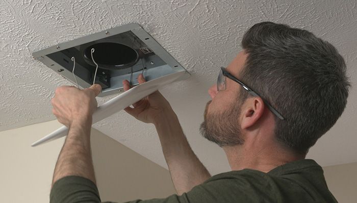 What is the cost of hiring a professional to fix your ventilation fan in the bathroom?