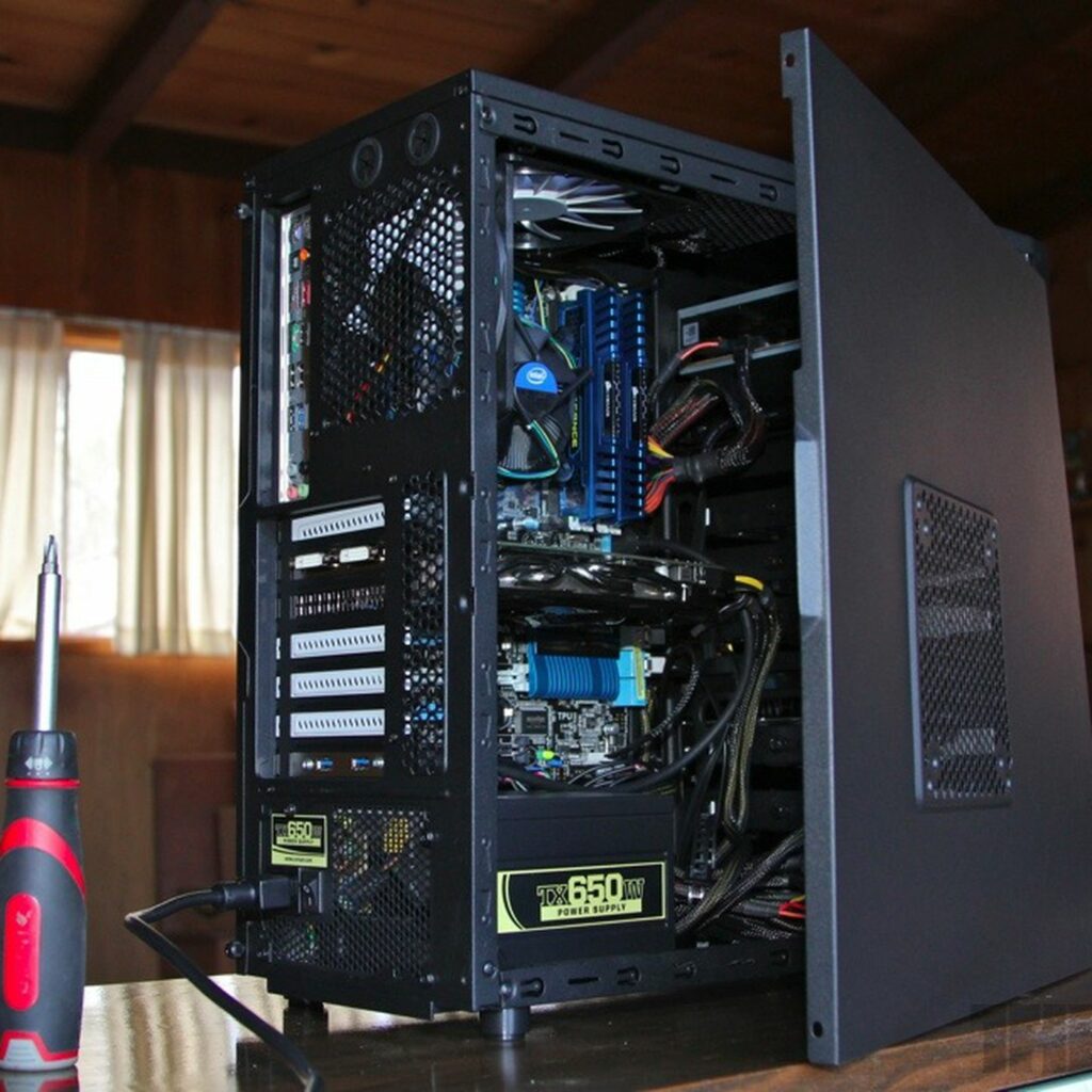 pc with an open cover showing its parts 