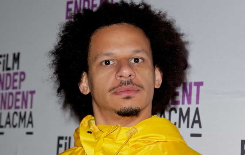 Eric Andre wearing a yellow coat