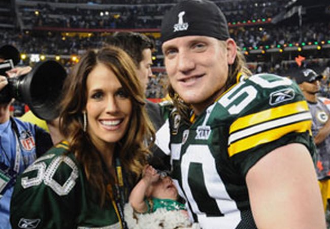 A.J Hawk with his wife and little kid