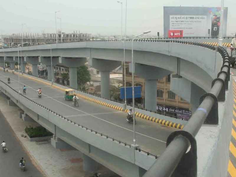 a double decker flyover with vehicles passing