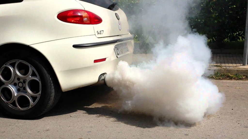A picture of smoke coming out from a car's exhaust.