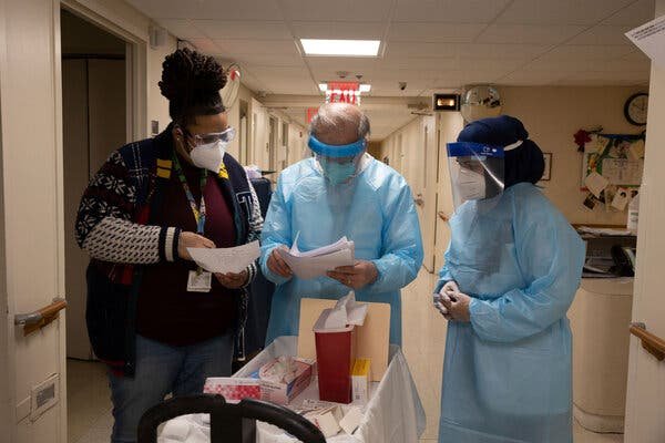 Pharmacists from CVS prepared to administer Covid-19 vaccines to nursing home residents in Harlem on Friday.