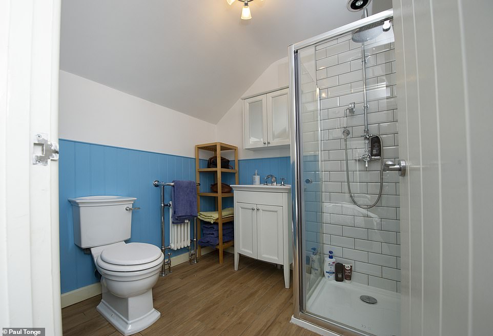 bathroom with tiles and white and blue painting