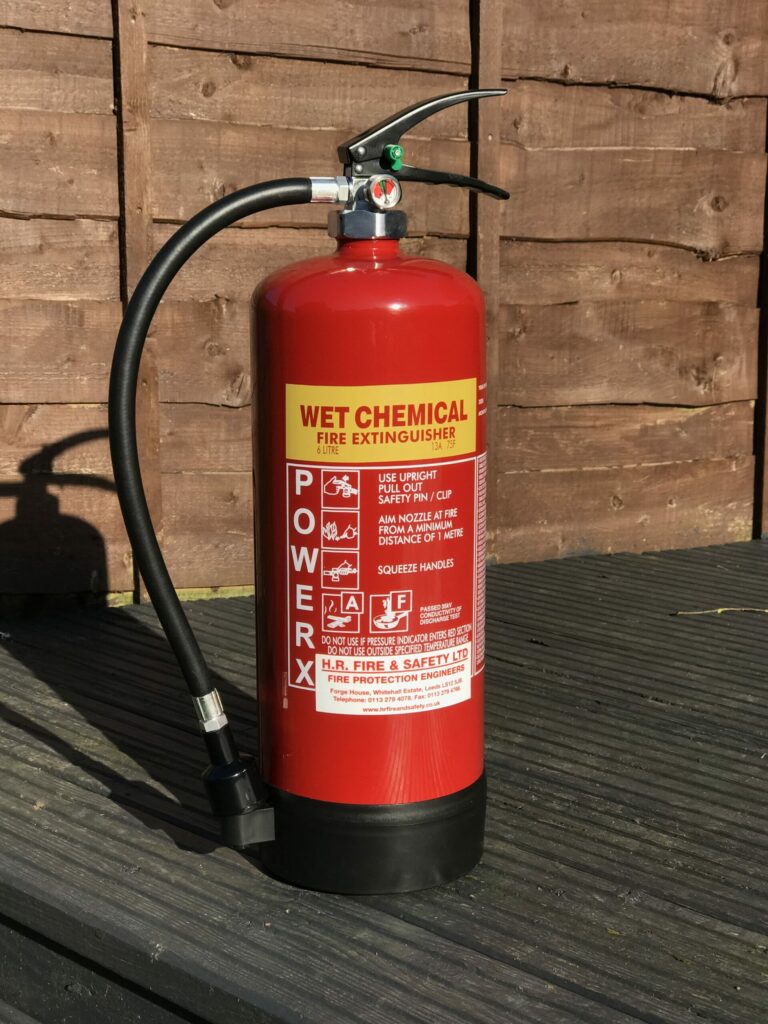 wet chemical fire extinguisher placed on the ground