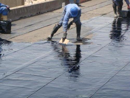 workers using black polyurethane membrane 