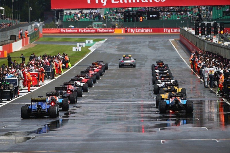 cars set to race on a racing track