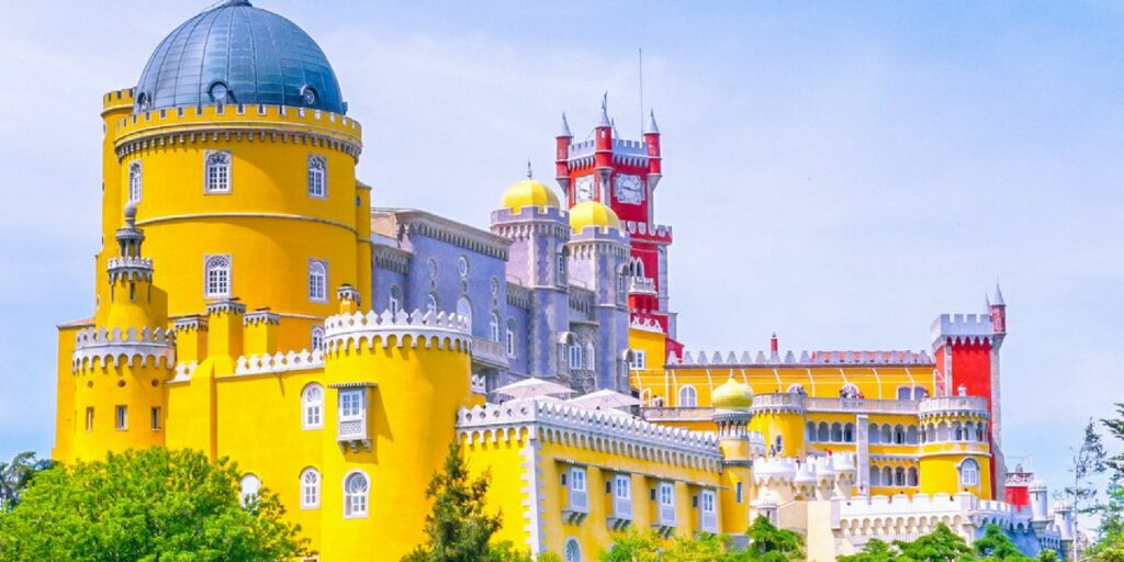 castle painted in yellow and red 