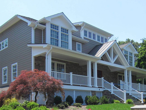 a duplex building in New Jersey with flowers at the entrance of the house