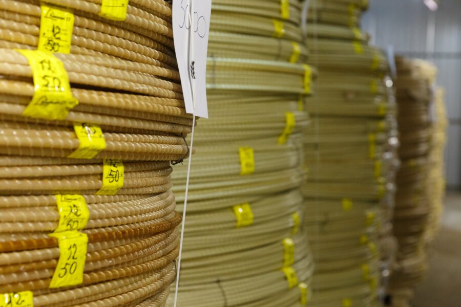 curved fibreglass rebars stored in a warehouse