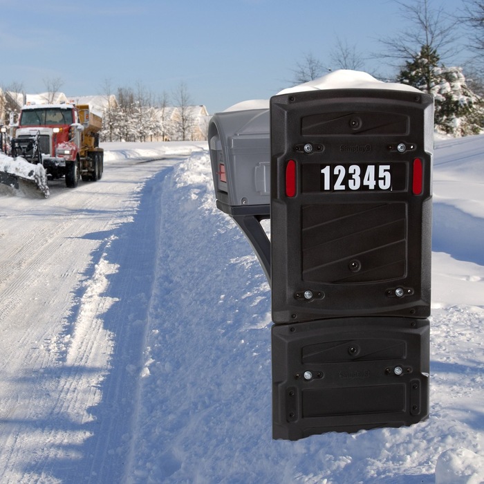 a mailbox shield made of plastic on a snow surface