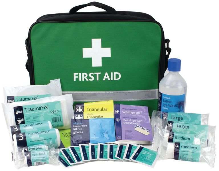 a first aid box with all the equipment set on the ground