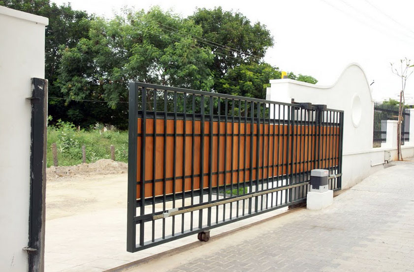 a black colored opened sliding gate 