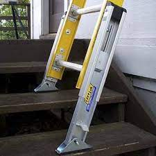 A picture showing leg extension that is added to a ladder so that it can be used on stairs.